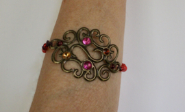 Armband met krullen, glitters en kraaltjes DONKER GOUD, NUANCES van ROOD, ROZE, PAARS, elastisch