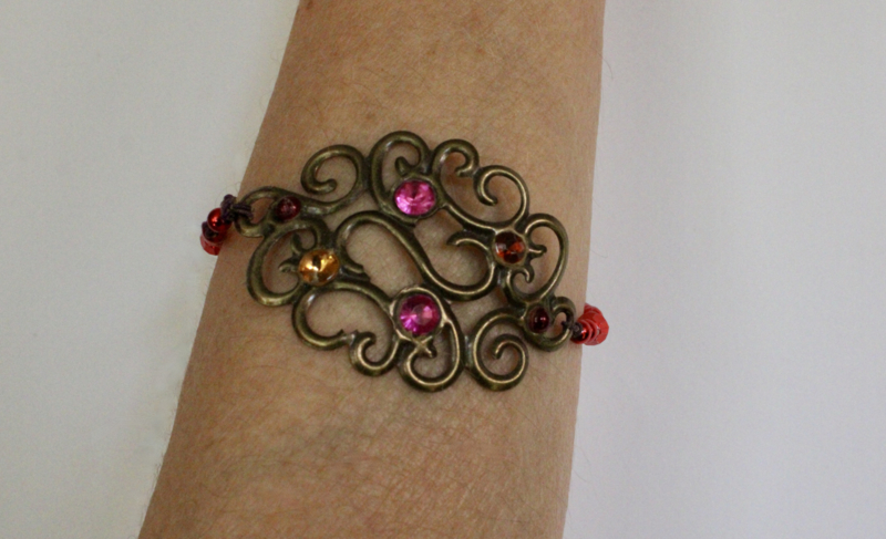 Curly bracelet, DARK GOLDEN, beads, glitter in shades of RED, PINK, PURPLE decorated