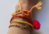 Ibiza "Orange" 4-piece bracelet set with little hearts, orange, yellow,  gold with fluorescent pink pom pom​