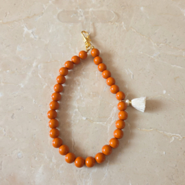 Cognac tassel | telefoonkoord