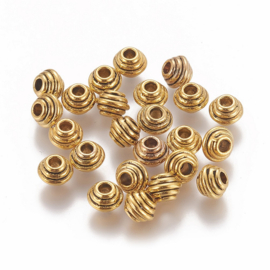 Spacer kraal geribbeld antiek goud, 12 stuks