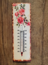 Thermometer met roze rozen