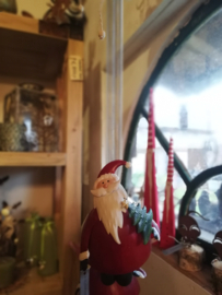 Kerstman met kerstboom aan springveer