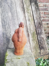 Dikke dame staand van gietijzer