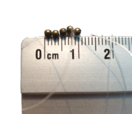 Kraaltje brons - ca. 2mm