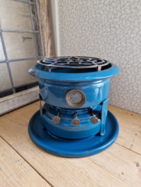 Petrol blauw emaille petroleumstel met onderbord