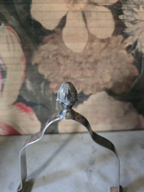 Verzilverde bordenklem