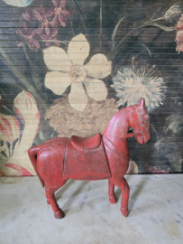 Oud rood houten paard