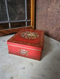 Oud rood blikken koektrommel