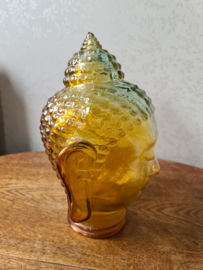 Geel glazen boeddha hoofd