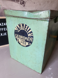 Antiek groen winkelblik van nelle uit 1915