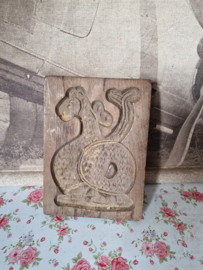 Oude houten koekplank draak