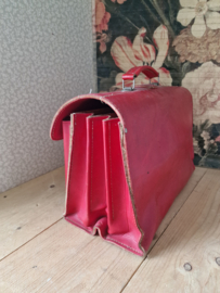 Oude rood leren schooltas