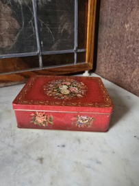 Oud rood blikken koektrommel
