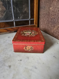 Oud rood blikken koektrommel