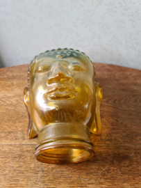 Geel glazen boeddha hoofd