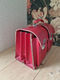 Oude rood leren schooltas