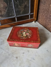 Oud rood blikken koektrommel