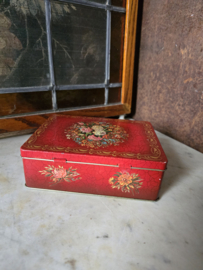 Oud rood blikken koektrommel