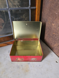 Oud rood blikken koektrommel
