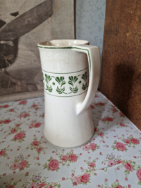 Oude beboterde kan art deco