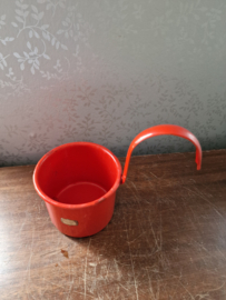 Oranje emaille melkschep