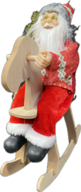 Kerstman op hobbelpaard H=35cm  KD7000