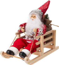 Kerstman op een slee - 15 x 27 x 25 cm  KD7200