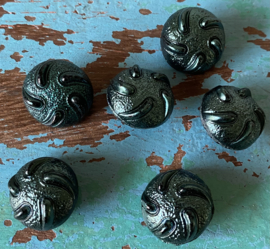 Donkergroene glans knopen