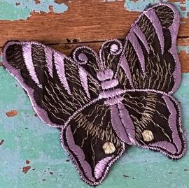 Zwart met paarse vlinder