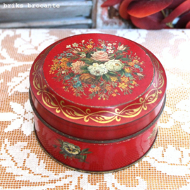 blikje rood met bloemen
