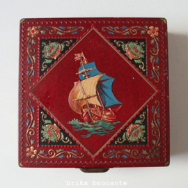 blik met zeilschip