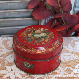 blikje rood met bloemen