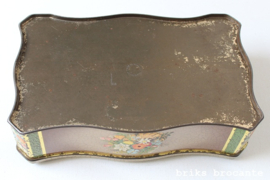 blik met bloemen in relief