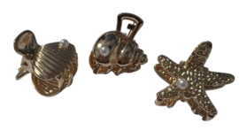 Haarklem schelpje klein 22 mm goud +pareltje