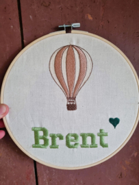 Borduurring met afbeelding van geboorte kaartje