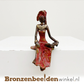 Zittende Afrikaanse vrouwenbeelden