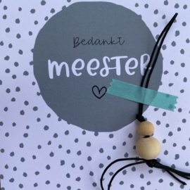 Kaart met gelukspoppetje:  bedankt Meester