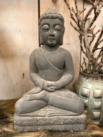 Cement statue sitting buddha