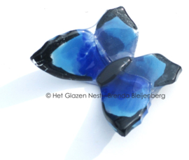 Klein blauw vlindertje van glas