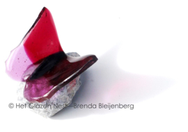Kleine vlinder in roze tinten