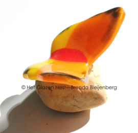 Kleine oranje vlinder van glas