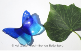 kleine vlinder in kobalt en aqua blauw