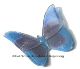 Kleine glas vlinder in paars en blauw