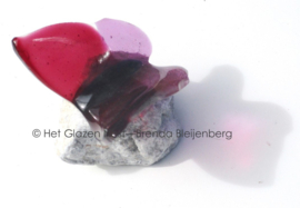 Kleine vlinder in roze tinten