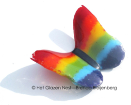 Glazen vlinder in regenboog kleuren