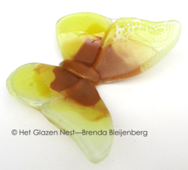 Glazen vlinder in gele kleuren