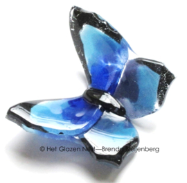 Klein blauw vlindertje van glas