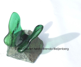 Groen vlindertje op Aventurijn steen