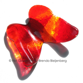 Vlinder in rood en oranje glas